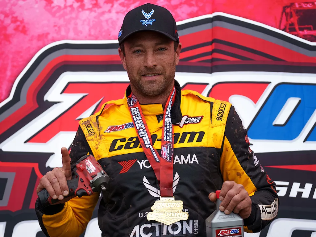 Kyle Chaney on podium AMSOIL in hand